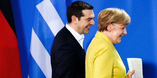 BERLIN, GERMANY - MARCH 23: German Chancellor Angela Merkel and Greek Prime Minister Alexis Tsipras arrive to speak to the media following talks at the Chancellery on March 23, 2015 in Berlin, Germany. The two leaders are meeting as relations between the Tsipras government and Germany have soured amidst contrary views between the two countries on how Greece can best work itself out of its current economic morass. (Photo by Carsten Koall/Getty Images)