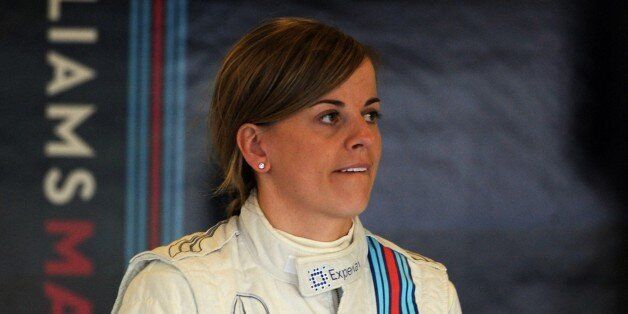 Scottish Suzie Wolff of Williams, the first woman to take part in a Formula 1 race weekend in 22 years, in the garage before first practice session at the British Grand Prix at Silverstone, England, on Friday, July 4, 2014, ahead of this weekend's Formula 1 British Grand Prix. Susie Wolff's bid to make an impact as the first woman to take part in a Formula One grand prix weekend for 22 years ended prematurely on Friday. Wolff, driving a Williams, idled to a halt after only three timed laps in th