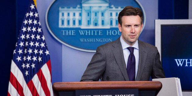 Josh Earnest, White House press secretary, speaks during the daily media briefing at the White House in Washington, D.C., U.S., on Friday, July 11, 2014. President Obama is open to working with Republicans on emergency funding to deal with child migrants at the border after the House Appropriations Committee chairman rejected the full $3.7 billion request, Earnest tolder reporters. Photographer: Drew Angerer/Bloomberg via Getty Images