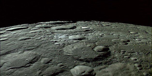 In this photo made out of an Oct. 31, 2007 HDTV image released by Japan Aerospace Exploration Agency (JAXA) and Japan's national broadcaster NHK, craters on the North Pole on the moon are shown. The still photo released on Wednesday, Nov. 7, 2007, was made out of the HDTV images of the moon taken for the first time in the world by an HDTV camera, developed specially by NHK for the use in the space and installed on Japan's first lunar probe SELENE's main satellite in orbit at an altitude of about 100 kilometers (60 miles), Tokyo-based JAXA and NHK said in their release Wednesday. (AP Photo/Japan Aerospace Exploration Agency and NHK, HO) **CREDIT MANDATORY TO JAXA/NHK, EDITORIAL USE ONLY**