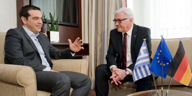 German Foreign Minister Frank-Walter Steinmeier, right, meets with Greek Prime Minister Alexis Tsipras in a hotel in Berlin, Germany, Tuesday, March 24, 2015. (AP Photo/Michael Gottschalk, Pool)
