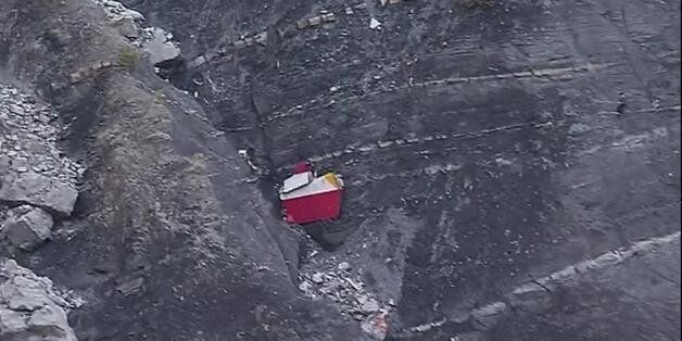 In this image made from TV, debris is scattered over the area after a Germanwings Airbus 320 crashed near Seyne-les-Alpes in the French Alps, Tuesday, March 24, 2015. A Germanwings passenger jet carrying at least 150 people crashed Tuesday in a snowy, remote section of the French Alps, sounding like an avalanche as it scattered pulverized debris across the mountain. (AP Photo / TF1, Pool)