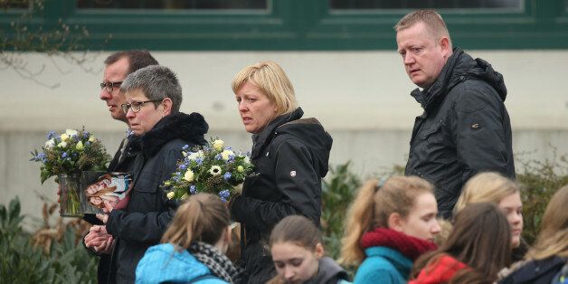 HALTERN, GERMANY - MARCH 25: Mourners arrive at the Joseph-Koenig-Gymnasium high school to pay tribute to 16 students and two teachers from the school who were on Germanwings flight 4U9525 that crashed yesterday in southern France on March 25, 2015 in Haltern, Germany. All 144 passengers and six flight crew are presumed dead and authorities are investigating the possible cause of the accident. (Photo by Sean Gallup/Getty Images)