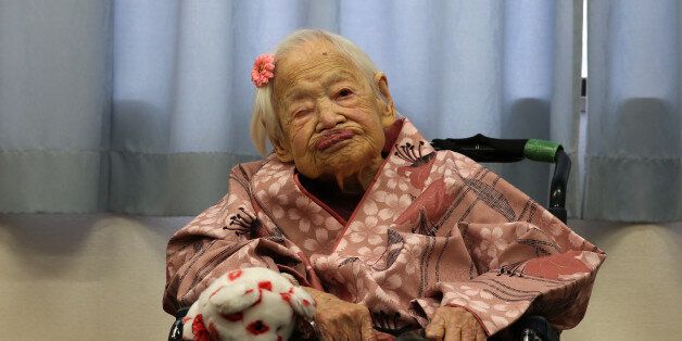 OSAKA, JAPAN - MARCH 04: Misao Okawa, the world's oldest Japanese woman, poses for a photo on her 117th birthday celebration at Kurenai Nursing Home on March 4, 2015 in Osaka, Japan. Japanese woman Misao Okawa is oldest living person in the world as certified by the Guinness World Records, who celebrates her 117 birthday on March 5. Okawa has been dubbed the worlds oldest living person since the June 12, 2013 death of 116 years and 54 days old Jiroemon Kimura, also Japanese. She is ranked first