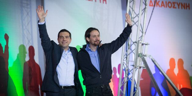 ATHENS, GREECE - JANUARY 22: Alexis Tsipras, leader of the radical leftist Syriza party is joined by Spanish Podemos party Secretary General Pablo Iglesias (R) as he campaigns at a pre-election rally ahead of this weekend's general election on January 22, 2015 in Athens, Greece. According to the latest opinion polls, the left-wing Syriza party are poised to defeat Prime Minister Antonis Samaras' conservative New Democracy party in the election, which will take place on Sunday. European leaders