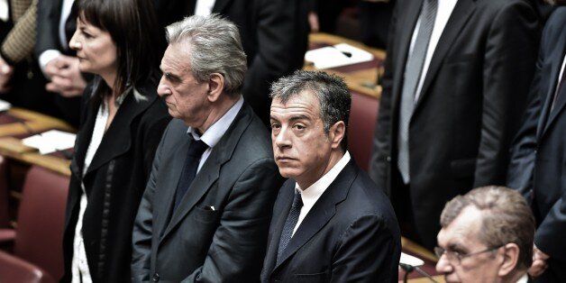 Leader of the pro-European party 'To Potami' Stavros Theodorakis (C) attends a swearing in ceremony of the new parliament in Athens on February 5, 2015. Greece's parliament met for the first time after last month's election amid market jitters sparked by an ECB block on a key source of funding for Athens' banks. AFP PHOTO / ARIS MESSINIS (Photo credit should read ARIS MESSINIS/AFP/Getty Images)