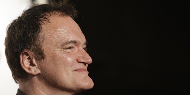 Director Quentin Tarantino looks on as he arrives at the opening ceremony of the 5th edition of the Lumiere Festival, in Lyon, central France, Monday, Oct. 14, 2013. (AP Photo/Laurent Cipriani)