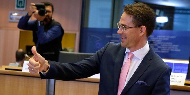 European Union Commissioner designate for Jobs, Growth, Investment and Competitiveness Jyrki Katainen shows a thumb up ahead of a hearing at the Committee on Economic and Monetary Affairs, the Committee on Employment and Social Affairs, the Committee on Industry, Research and Energy and the Committee on Transport and Tourism and the Committee on Regional Development, at the European Parliament in Brussels, on Tuesday, Oct. 7, 2014. (AP Photo/Yves Logghe)