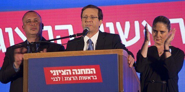 TEL AVIV, ISRAEL - MARCH 17: Zionist Union party leader Isaac Herzog delivers a speech next to his wife Michal in the party's election headquarters after the first results of the Israeli general election in Tel Aviv, Israel, on March 17, 2015. (Photo by Stringer/Anadolu Agency/Getty Images)