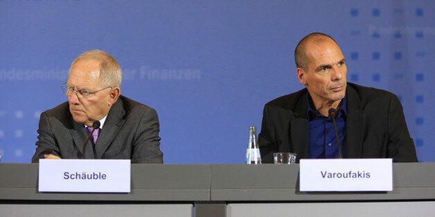 Yanis Varoufakis, Greece's finance minister, right, and Wolfgang Schaeuble, Germany's finance minister, attend a news conference at the Chancellery in Berlin, Germany, on Thursday, Feb. 5, 2015. The meeting comes hours after Greece lost a critical funding artery when the European Central Bank restricted loans to its financial system. Photographer: Krisztian Bocsi/Bloomberg via Getty Images