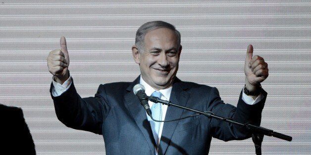 TEL AVIV, ISRAEL - MARCH 18: Israeli Prime Minister and the leader of the Likud Party Benjamin Netanyahu greets supporters at the party's election headquarters after the first results of the Israeli general election on March 18, 2015 in Tel Aviv, Israel. (Photo by Salih Zeki Fazlioglu/Anadolu Agency/Getty Images)