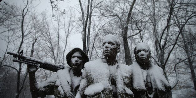 WASHINGTON, DC - MARCH 05: Heavy snow coats The Three Soldiers statue near the Vietnam Veterans Memorial on the National Mall March 5, 2015 in Washington, DC. As a huge winter storm moves across the United States from Texas to Maine, the capital region is forecast to get five to ten inches of snowfall. (Photo by Chip Somodevilla/Getty Images)