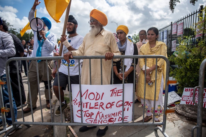 Protesters chant and wave flags outside after a rally attended by Indian Prime Minister Narendra Modi at NRG Stadium on September 22, 2019 in Houston, Texas.
