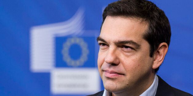 Greece's Prime Minister Alexis Tsipras addresses the media at the European Commission headquarters in Brussels Friday, March 13, 2015. (AP Photo/Geert Vanden Wijngaert)