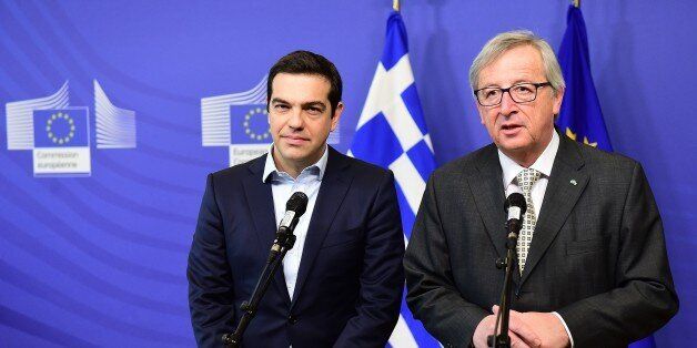 Greece's Prime Minister Alexis Tsipras (L) and European Commission President Jean-Claude Juncker address the media at the European Commission in Brussels on March 13, 2015. Tsipras is in Brussels for talks on Athens' debt-hit bailout. AFP PHOTO / Emmanuel Dunand (Photo credit should read EMMANUEL DUNAND/AFP/Getty Images)
