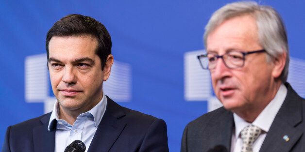 European Commission President Jean-Claude Juncker, right, and Greece's Prime Minister Alexis Tsipras address the media at the European Commission headquarters in Brussels on Friday, March 13, 2015.(AP Photo/Geert Vanden Wijngaert)