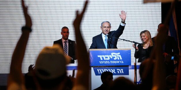 FILE - In this March 17, 2015 file photo, Israeli Prime Minister Benjamin Netanyahu greets supporters at the party's election headquarters in Tel Aviv, Israel. Netanyahu's Likud won 30 seats in the 120-seat parliament, and parties apparently willing to back him won another 37 for a possible majority. The reasons for that outcome go beyond the party's nationalist ideology and include Israel's sense of geographic vulnerability, its fragmented politics and a master campaigner in Netanyahu himself.