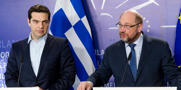 Greece's Prime Minister Alexis Tsipras, left, and European Parliament President Martin Schulz address the media at the European Parliament in Brussels on Friday, March 13, 2015. Tspiras is on a one-day visit to meet with EU officials. (AP Photo/Thierry Monasse)