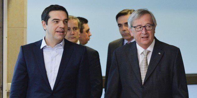 BRUSSEL, BELGIUM - MARCH 13: European Commission President Jean-Claude Juncker (R) welcomes Greek Prime Minister Alexis Tsipras prior to a meeting at the European Commission headquarters in Brussels, Belgium, on March 13, 2015. (Photo by Dursun Aydemir/Anadolu Agency/Getty Images)