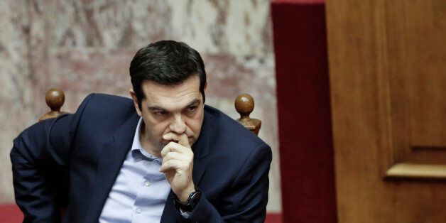 Greece's Prime Minister Alexis Tsipras attends a parliament session in Athens, on Tuesday, March 10, 2015. Tsipras spoke during a special debate on whether to revive a parliamentary committee that would seek German World War II reparations that Greece says were never fully paid. The committee would also seek the return of a forced loan raised by Nazi occupation forces, and of Greek antiquities removed during the war. (AP Photo/Petros Giannakouris)