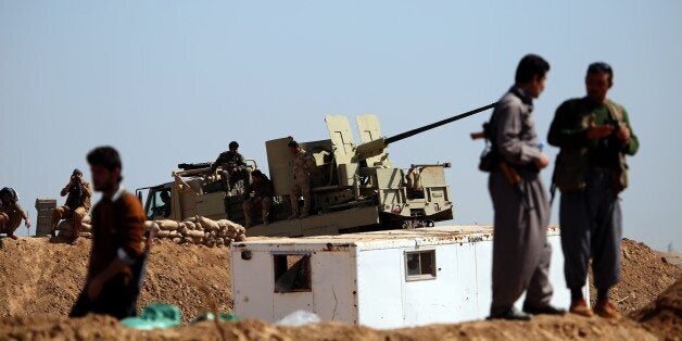 KIRKUK, IRAQ - MARCH 10 : Kurdish Peshmerga forces are seen in Tel Al Werd village 25 km far from Mulla Abdullah district, south of Kirkuk as they guard the area on March 10, 2015 during the ongoing clashes between Daesh (Islamic State of Iraq and the Levant) militants in Iraq. (Photo by Emrah Yorulmaz/Anadolu Agency/Getty Images)