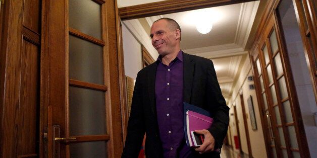 Yanis Varoufakis, Greece's finance minister, reacts as he arrives at the Greek parliament building to attend a cabinet meeting in Athens, Greece, on Tuesday, Feb. 23, 2015. Greece moved closer to winning an extension of financial aid after the head of the group of euro-region finance ministers said creditors were favorable toward the government's package of new economic measures. Photographer: Kostas Tsironis/Bloomberg via Getty Images