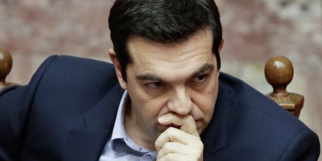 Greece's Prime Minister Alexis Tsipras attends a parliament session in Athens, on Tuesday, March 10, 2015. Tsipras spoke during a special debate on whether to revive a parliamentary committee that would seek German World War II reparations that Greece says were never fully paid. The committee would also seek the return of a forced loan raised by Nazi occupation forces, and of Greek antiquities removed during the war. (AP Photo/Petros Giannakouris)