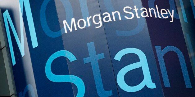 FILE - In this Oct. 18, 2011, file photo, the Morgan Stanley logo is displayed on its Times Square building. Morgan Stanley has agreed to pay $2.6 billion to settle federal charges over its role in the mortgage bubble and subsequent financial crisis. (AP Photo/Mark Lennihan, File)