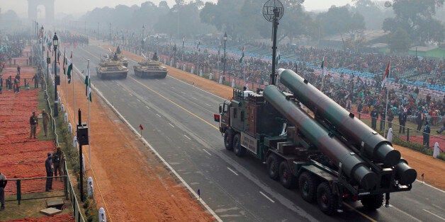 FILE- In this Jan. 23, 2011 file photo, Indian army Brahmos missile launcher passes on a flotilla towards the India Gate memorial during rehearsal for the Republic Day parade in New Delhi, India. In its race to join the club of international powers, India has reached another major milestone, it's now the world's largest weapons importer. A Swedish think tank that monitors global arms sales said Monday that India's weapons imports had overtaken China's, as the South Asian nation pushes ahead with plans to modernize its military, counter Beijing's influence and gain international prestige and clout. (AP Photo/Gurinder Osan, File)