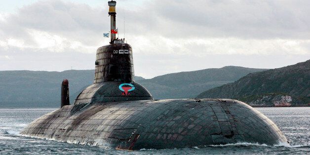 One of Russia's largest Soviet-built nuclear submarines, Typhoon (Akula) class, which remains the world's largest with the displacement of about 25,000 metric tons (27,500 tons) heaves ahead in the Barents Sea at Russia's Arctic Coast in this September 2001 photo. The Northern Fleet submarine Arkhangelsk, Typhoon (Akula) class, on Wednesday successfully test-fired a ballistic missile from beneath the waters off Russia's Arctic Coast and hit the designated target at the navy's Kura range on the K