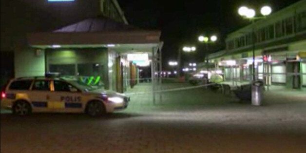 In this image from Swedish TV4 a police car sits near the Var Krog och Bar in the city of Goteborg Wdenesday night March 18, 2015. Several people were shot inside a restaurant in the city of Goteborg late Wednesday and at least two of them have died, Swedish police said. (AP Photo/TV4)