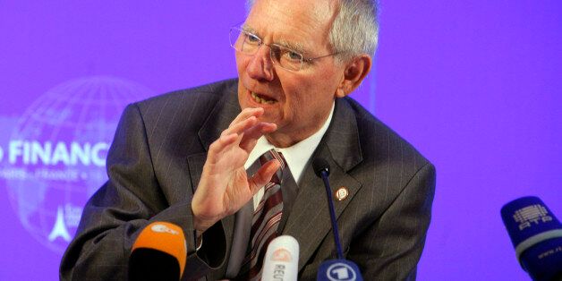 German's Finance Minister Wolfgang Schauble gestures during the press conference ending the G20 Finance summit at Bercy Finance Ministry in Paris, Saturday, Feb. 19, 2011. The world's dominant economies have reached a compromise deal on how to track imbalances in the global economy that have been blamed for exacerbating the financial crisis, French Finance Minister Christine Lagarde said Saturday. Finance ministers and central bank governors from the Group of 20 rich and developing countries managed to get China to agree on a list of yardsticks for imbalances, by softening the criteria for measuring current account surpluses. (AP Photo/Jacques Brinon)