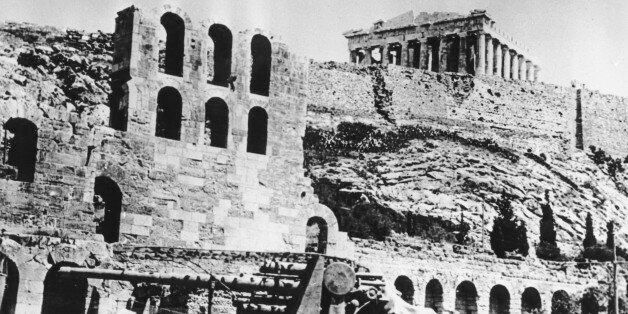 A battery of German anti-aircraft forces stops beneath the Acropolis in Athens, Greece on May 27, 1941 during World War II. The Nazi occupation began on April 27. (AP Photo)