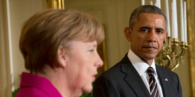 President Barack Obama listens as German Chancellor Angela Merkel speaks during their joint news conference in the East Room of the White House in Washington, Monday, Feb. 9, 2015. The leaders were expected to discuss the ongoing conflict in Ukraine, and arming Ukrainian fighters to wage a more effective battle against Russian-backed separatists. (AP Photo/Pablo Martinez Monsivais)