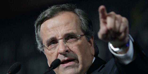 Greece's Prime Minister Antonis Samaras delivers his final campaign speech at the Taekwondo Indoor Stadium in southern Athens on Friday, Jan. 23, 2015. All opinion polls on Sunday's closely-watched national election agree: The radical left opposition Syriza party, which has vowed to rewrite the terms of Greece's international bailout, enjoys a lead of at least 4 percentage points over Prime Minister Antonis Samaras' conservatives. (AP Photo/Lefteris Pitarakis)