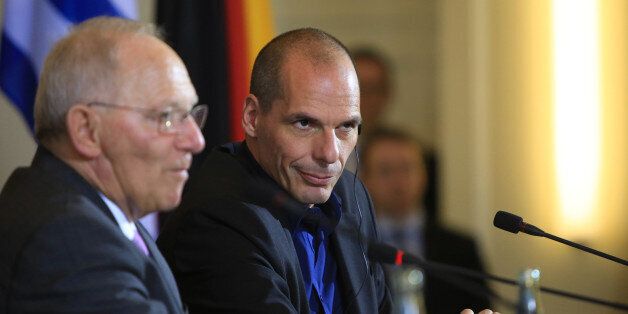 Yanis Varoufakis, Greece's finance minister, right, sits beside Wolfgang Schaeuble, Germany's finance minister, during a news conference at the Chancellery in Berlin, Germany, on Thursday, Feb. 5, 2015. The meeting comes hours after Greece lost a critical funding artery when the European Central Bank restricted loans to its financial system. Photographer: Krisztian Bocsi/Bloomberg via Getty Images