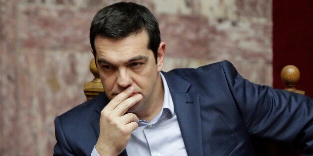 Greece's Prime Minister Alexis Tsipras gestures during a Presidential vote in Athens, on Wednesday, Feb. 18, 2015. Greece's parliament elected a conservative law professor and veteran politician Wednesday as the country's new president, after he received support from the new left-wing government and main center-right opposition party. (AP Photo/Petros Giannakouris)