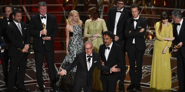 Michael Keaton, left, and Alejandro G. Inarritu, and the cast and crew of âBirdman or (The Unexpected Virtue of Ignorance)â accept the award for the best picture at the Oscars on Sunday, Feb. 22, 2015, at the Dolby Theatre in Los Angeles. (Photo by John Shearer/Invision/AP)