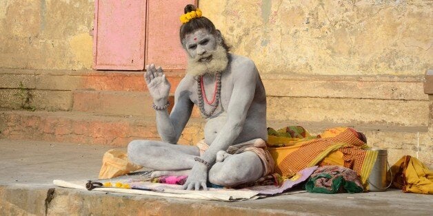 VARANASI, INDIA - 2015/02/21: A sadhu performing morning ritual at Dashaswamegh Ghat bank of River Ganges. (Photo by Prabhat Kumar Verma/Pacific Press/LightRocket via Getty Images)