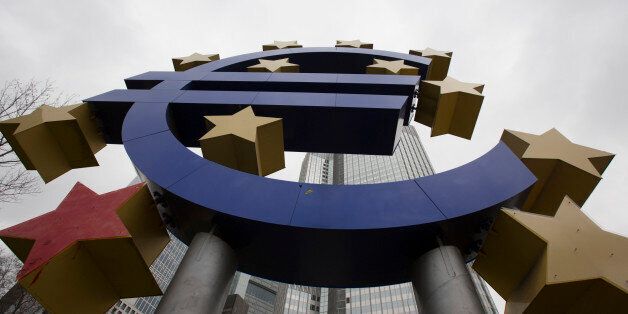 A euro sign sculpture stands in front of the former European Central Bank (ECB) headquarters in Frankfurt, Germany, on Wednesday, Jan. 28, 2015. Economic sentiment in the euro area rose for the first time in three months after the European Central Bank committed to spend at least 1.1 trillion ($1.3 trillion) euros on fueling growth and inflation. Photographer: Martin Leissl/Bloomberg via Getty Images