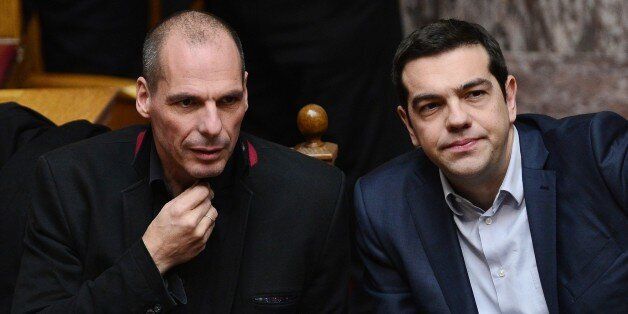 Greek Prime Minister Alexis Tsipras (R) and Finance Minister Yianis Varoufakis sit during the vote for president at the Greek parliament in Athens on February 18, 2015. Finance Minister Yanis Varoufakis said Wednesday Athens' formal request for a loan extension from the EU would meet the demands of both the Greeks and the Eurogroup, and he was optimistic a deal could be reached. AFP PHOTO / LOUISA GOULIAMAKI (Photo credit should read LOUISA GOULIAMAKI/AFP/Getty Images)