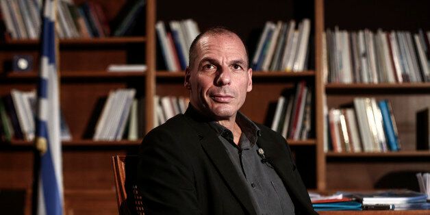 Yanis Varoufakis, Greece's finance minister, waits for the start of a Bloomberg Television interview at his office in Athens, Greece, on Wednesday, Feb. 25, 2015. Varoufakis said he's counting on the European Central Bank to help the country avert default when it runs out of money next month, while bank deposits are also starting to flow back. Photographer: Yorgos Karahalis/Bloomberg via Getty Images