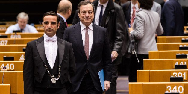 European Central Bank Governor Mario Draghi, center, arrives at the European Parliament in Brussels, Wednesday, Feb. 25, 2015. (AP Photo/Geert Vanden Wijngaert)