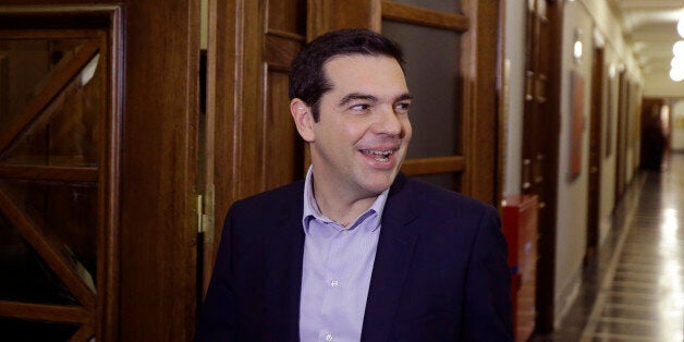 Greece's Prime Minister Alexis Tsipras arrives for an inner meeting at the parliament in Athens on Tuesday, Feb. 24, 2015. Caught between its campaign pledges and pressure from creditors, Greece's left-wing Syriza government delivered the list on the cusp of Monday night's deadline. The government was asked to present a list last Friday at a meeting of the 19 finance ministers of the eurozone so its bailout request could be met. (AP Photo/Thanassis Stavrakis)