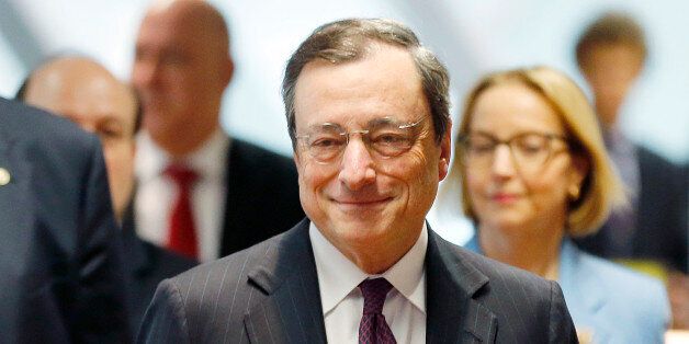 President of European Central Bank Mario Draghi is on his way to the unveiling of the new 20 euro banknote in Frankfurt, Germany, Tuesday, Feb. 24, 2015. (AP Photo/Michael Probst)
