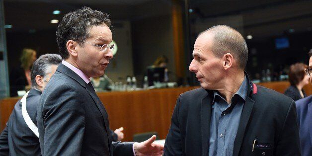 Eurogroup President and Dutch Finance Minister Jeroen Dijsselbloem (L) speaks with Greece's Finance Minister Yanis Varoufakis as they arrive to take part in an European economic and financial affairs (ECOFIN) meeting at the European Council in Brussels, on February 17, 2015. AFP PHOTO/Emmanuel Dunand (Photo credit should read EMMANUEL DUNAND/AFP/Getty Images)