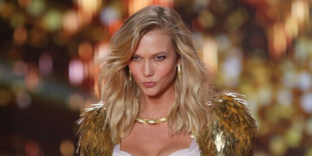 Model Karlie Kloss displays a creation at the Victoria's Secret fashion show in London, Tuesday, Dec. 2, 2014. (Photo by Joel Ryan/Invision/AP)