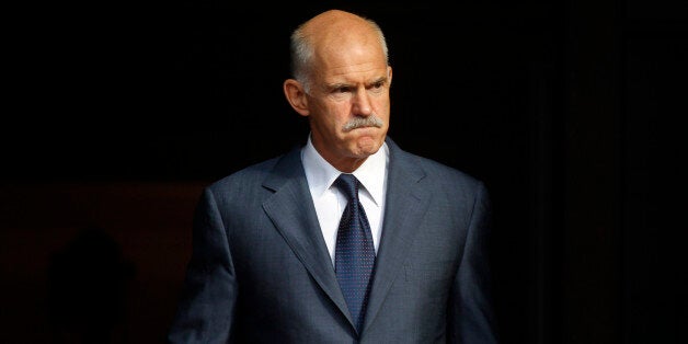 FILE In this Saturday, Oct. 1, 2011, file photo Greece's Prime Minister George Papandreou awaits the Emir of Qatar, , for a meeting at the Prime Minister's official residence in Athens. Former Greek prime minister George Papandreou has revealed plans to create a new political party â a development that will see him break away from the once powerful PanHellenic Socialist Movement founded by his father. Papandreou, 62, announced the plan on his website Friday, Jan. 2, 2015, ahead of a snap general election on Jan. 25.(AP Photo/Kostas Tsironis, File)