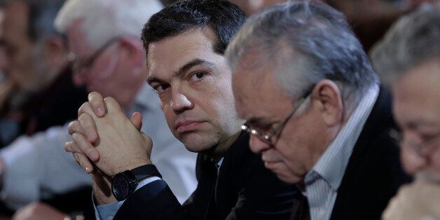 Greek Prime Minister and Syriza leader Alexis Tsipras, third right, looks on at his party central committee, in Athens, on Saturday, Feb. 28, 2015. Greece's new radical left government has no intention of seeking yet another bailout deal from international creditors and will spend coming months trying to ease the terms of its current commitments, the financially struggling country's prime minister said Friday. (AP Photo/Petros Giannakouris)