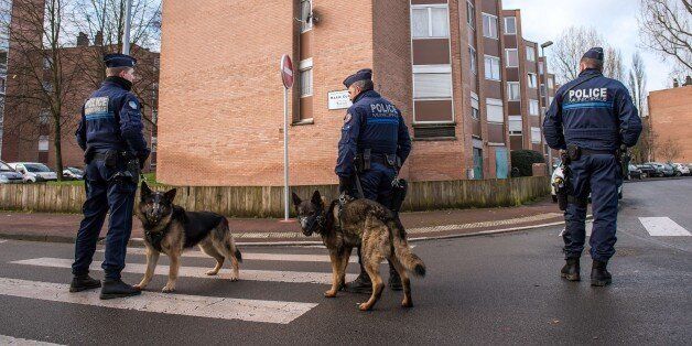 French municipal police patrol a street with police dogs in the northern city of Tourcoing on January 29, 2015, they work under the direct authority of a mayor. AFP PHOTO / PHILIPPE HUGUEN (Photo credit should read PHILIPPE HUGUEN/AFP/Getty Images)